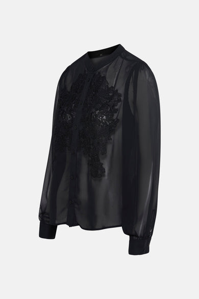 Chemise noire à manches longues de MEXX ornée de broderies florales sur le devant.
