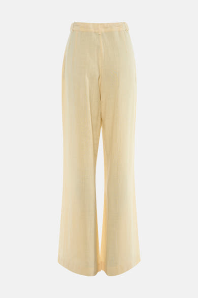 Pantalon jaune de MEXX, coupe ample, matière texturée, vue arrière sur fond neutre.