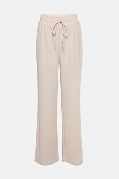 Pantalon écru de MEXX, à texture gaufrée et coupe ample avec cordon de serrage à la taille.

