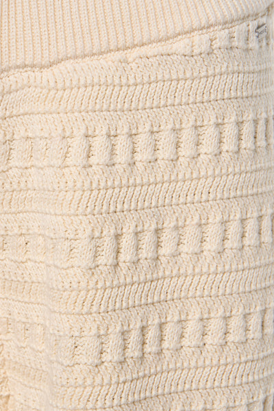 Short beige de Mexx avec motif texturé en maille torsadée.