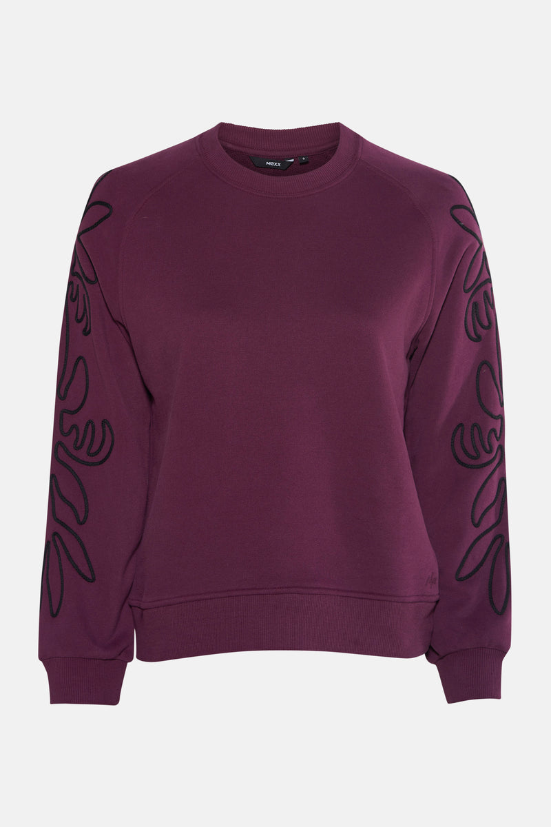 Paarse MEXX sweater met zwart bloemenpatroon op de mouwen, achterzijde.