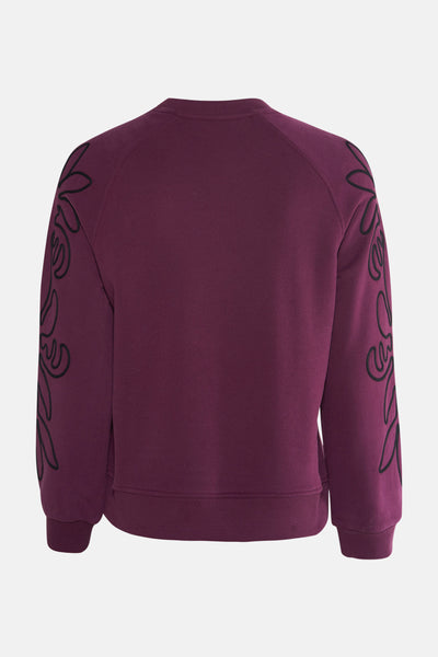Sweat mauve de MEXX avec motif floral noir sur les manches, vue arrière.
