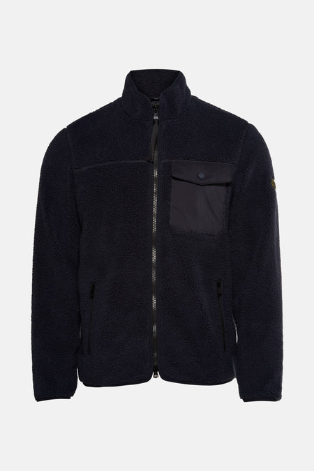 Veste en polaire bleu par Barbour, avec fermeture éclair centrale, poches latérales et poche poitrine à bouton.