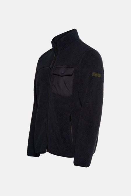 Veste bleu marine en polaire par Barbour International, avec poche poitrine plaquée et fermeture zippée.