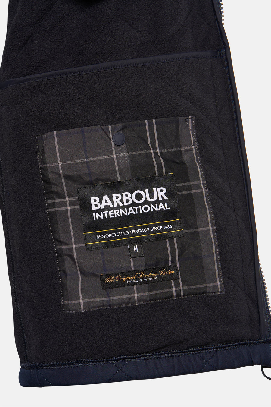 Blauwe mouwloze jas van BARBOUR, met ruitpatroon op de zak en gewatteerde voering.