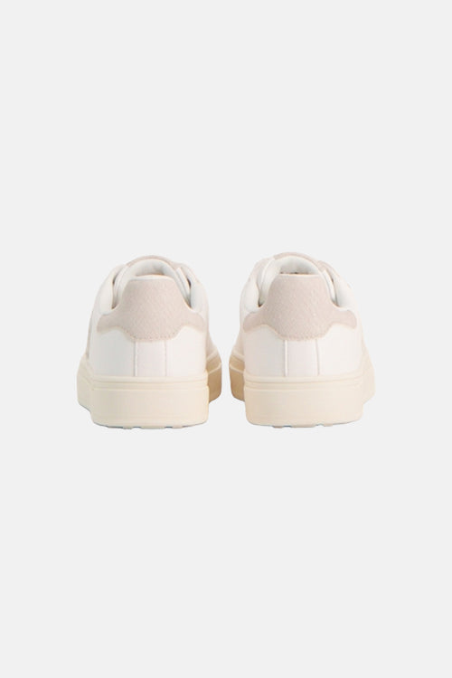 Baskets blanches de MEXX avec empiècements texturés beiges et semelles crème, vue de dos.