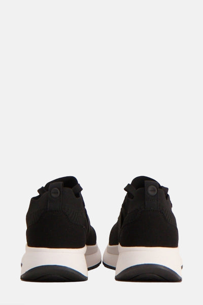 Zwarte MEXX sneakers, achteraanzicht met witte zool en textuurdetails aan de bovenkant.