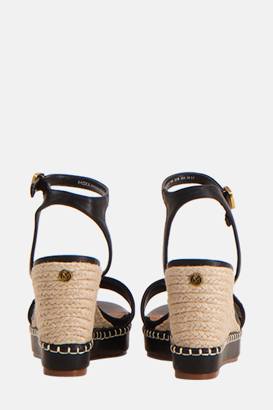 Escarpins noirs par MEXX, à talon compensé en corde tressée et bride de cheville noire.