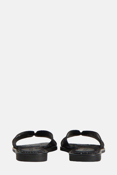 Sandales noires de MEXX, avec des détails texturés sur la semelle et la bride.