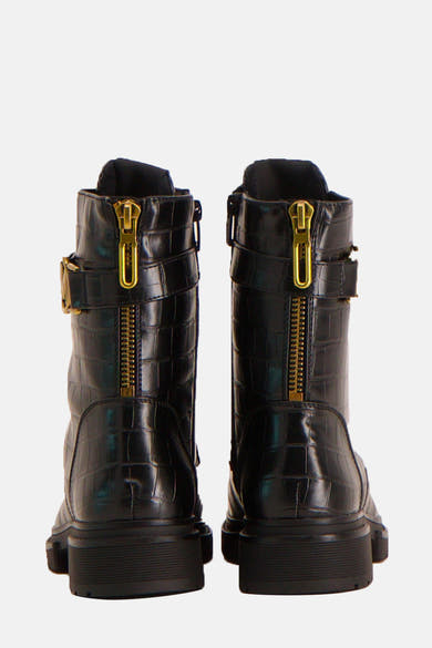 Bottines noires en similicuir de MEXX, avec fermeture éclair dorée à l'arrière et bride à boucle.
