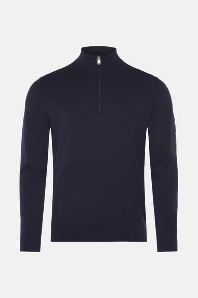 Blauwe coltrui van Barbour International met een zilveren ritssluiting aan de voorkant.