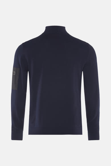 Barbour blauwe coltrui, met een discrete patch op de linkermouw.