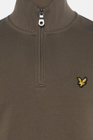 Khaki ribbed turtleneck sweatshirt by Lyle & Scott with gold eagle patch and silver zipper, front close-up view