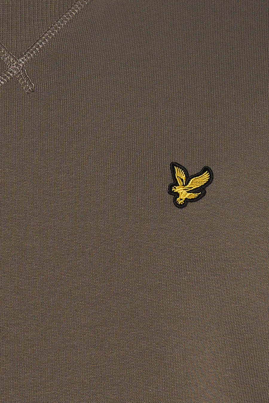 Khaki crewneck sweatshirt with ribbed texture and gold embroidered eagle patch on chest, close-up view