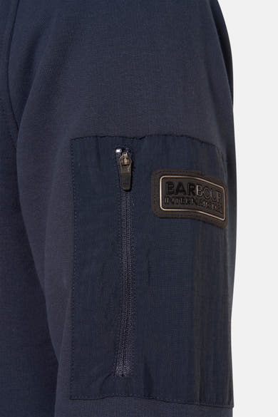Sweat-shirt bleu foncé par BARBOUR International avec poche zippée sur la manche.