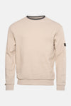 Sweat écru de BARBOUR avec col orné de rayures contrastées et badge logo sur la manche.