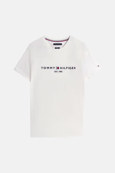 White short-sleeve T-shirt by Tommy Jeans with front logo print, ribbed crew neck, and striped trim.