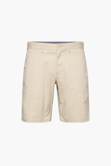 Beige cotton bermuda shorts with front button closure and side pockets, front view