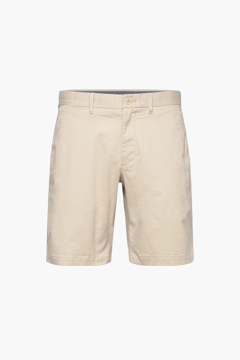 Beige cotton bermuda shorts with front button closure and side pockets, front view