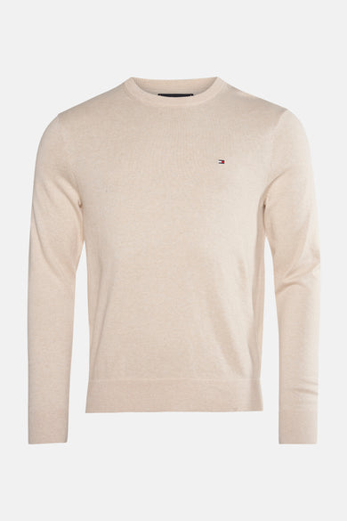 Pull à col rond beige de TOMMY HILFIGER, avec logo discret sur la poitrine.