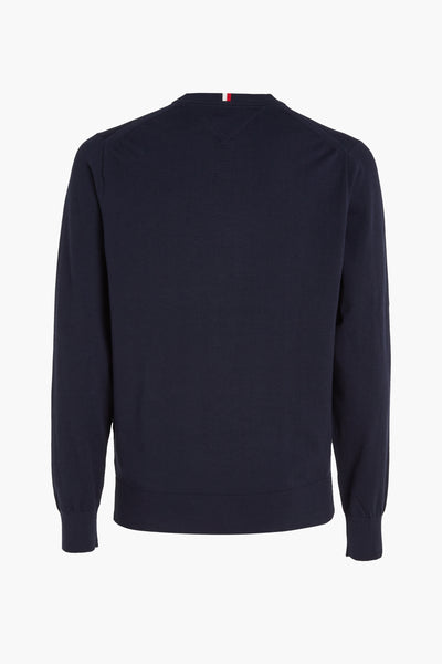 Donkerblauwe gebreide trui van Tommy Hilfiger, met kenmerkende strepen bij de nek.