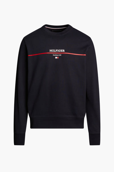 Sweat-shirt bleu de Tommy Hilfiger, avec logo blanc et bande rouge sur la poitrine.