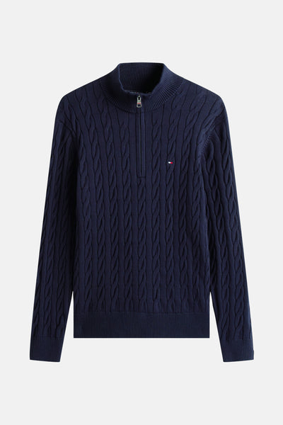 Pull à col roulé bleu de TOMMY HILFIGER, en maille torsadée avec fermeture éclair courte.