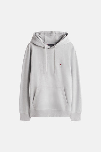 Grijze Tommy Hilfiger hoodie met witte trekkoord en kangoeroezak aan de voorkant.