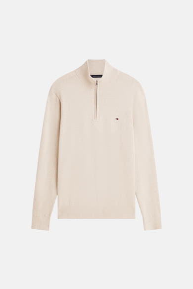 Pull à col roulé beige de Tommy Hilfiger avec fermeture éclair partielle sur le devant.