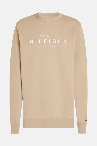 Beige ronde hals sweatshirt van Tommy Hilfiger, met opdruk van het logo op de voorkant en een klein label op de mouw.