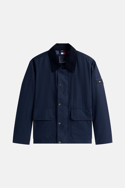 Veste bleue en nylon de Tommy Hilfiger avec col en velours côtelé et poches plaquées.