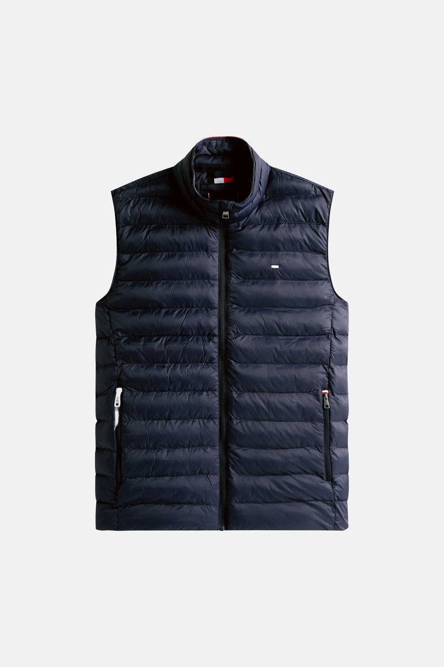 Blauwe bodywarmer van TOMMY HILFIGER, gewatteerd, met opstaande kraag, ritssluiting en borstlogo.