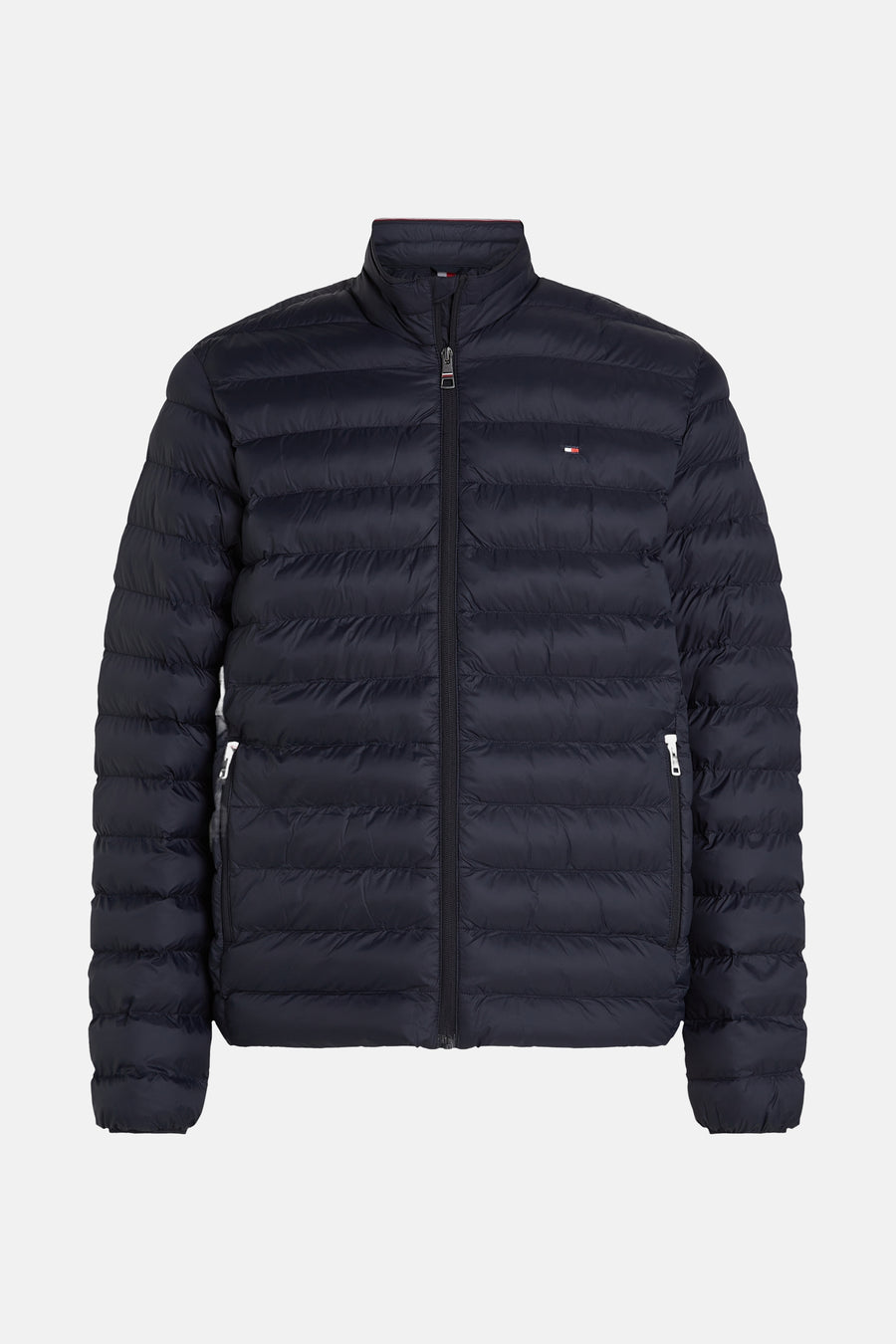 Veste courte bleu marine de TOMMY HILFIGER, doudoune matelassée à col montant avec bande tricolore et logo.