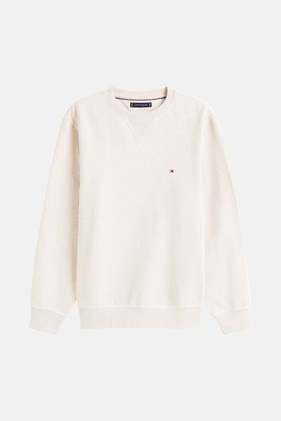 Sweat col rond écru de Tommy Hilfiger, avec un petit logo brodé sur la poitrine.