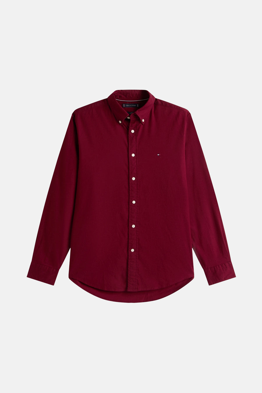 Chemise bordeaux à manches longues de TOMMY HILFIGER, avec une fermeture boutonnée et un logo brodé.

