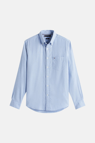Chemise à manches longues bleue de TOMMY HILFIGER, avec poche poitrine simple et texture subtile.