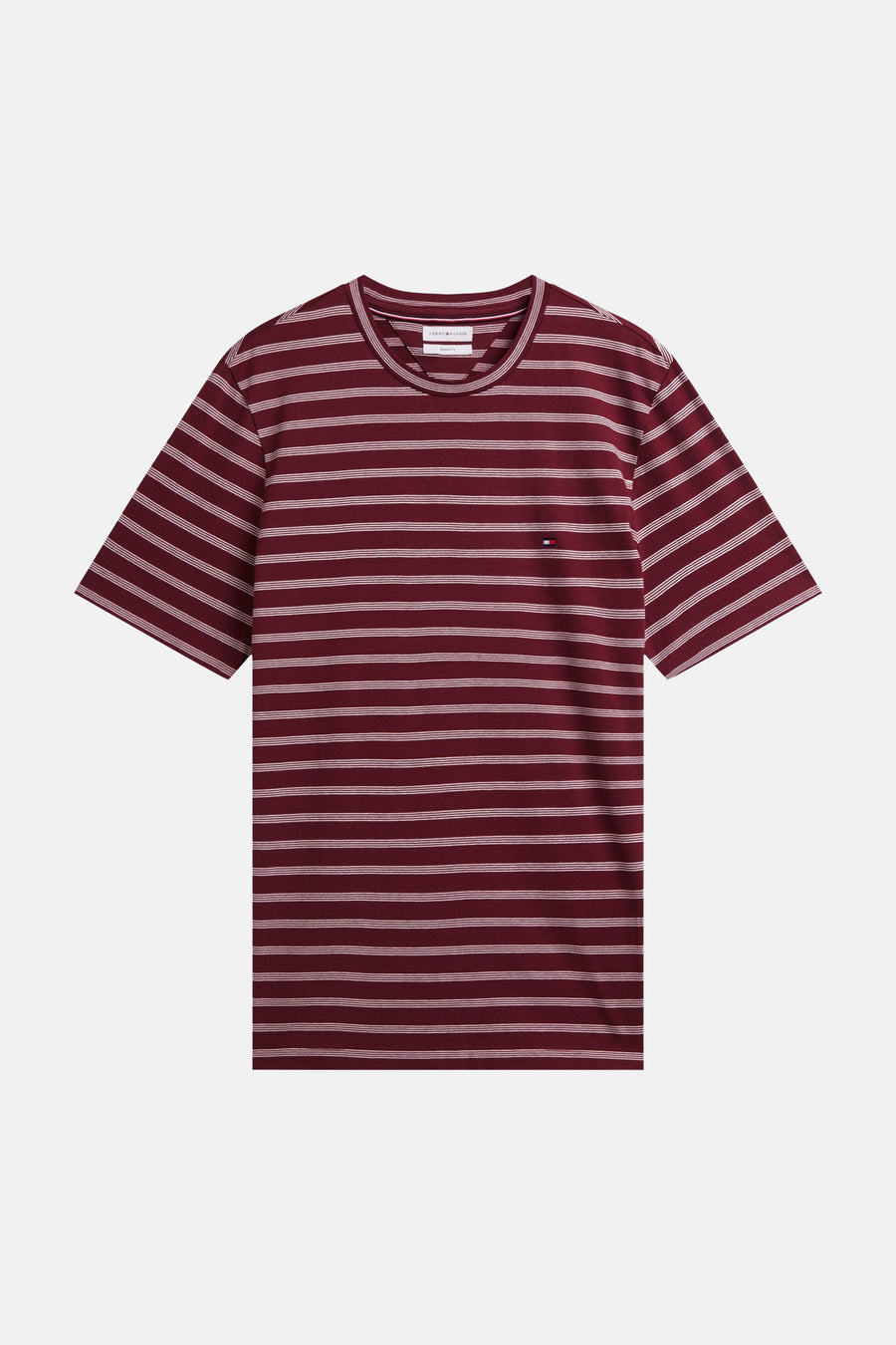 Burgundy short-sleeve t-shirt with white horizontal stripes by Tommy Hilfiger, featuring a round neckline and small flag logo on chest, front view.
