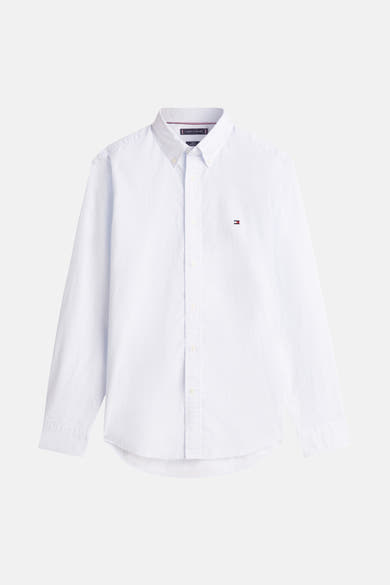 Chemise à manches longues bleue de TOMMY HILFIGER, avec un subtil motif texturé et le logo brodé sur la poitrine.