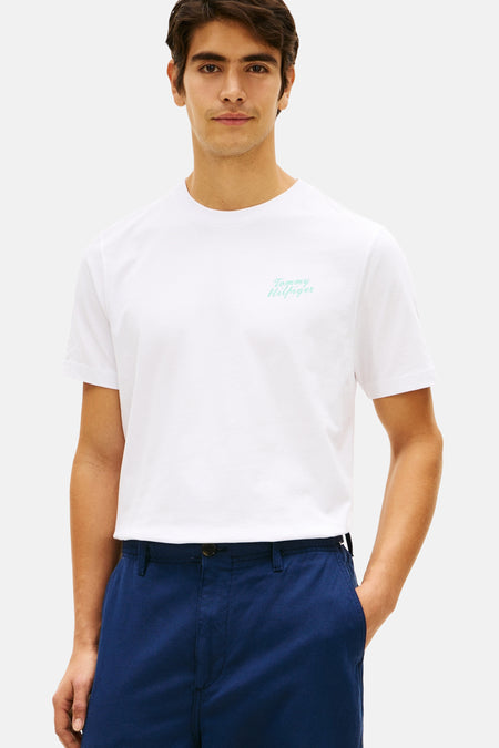 Wit T-shirt met korte mouwen van TOMMY HILFIGER met een licht turquoise logo op de borst.