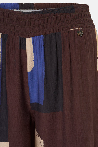 Pantalon multicolore de AMELIE ET AMELIE, avec taille élastique et motif abstrait géométrique.
