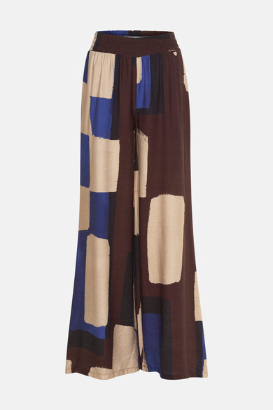 Pantalon multicolore d'AMELIE ET AMELIE, à larges jambes avec motif géométrique bloc de couleurs.