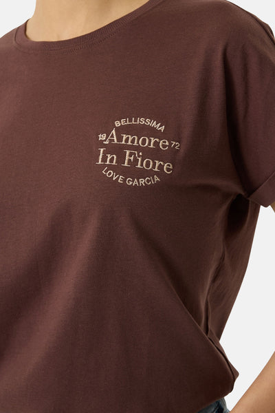 Brown short-sleeve t-shirt with cream embroidered logo "Amore In Fiore" on chest, close-up front view