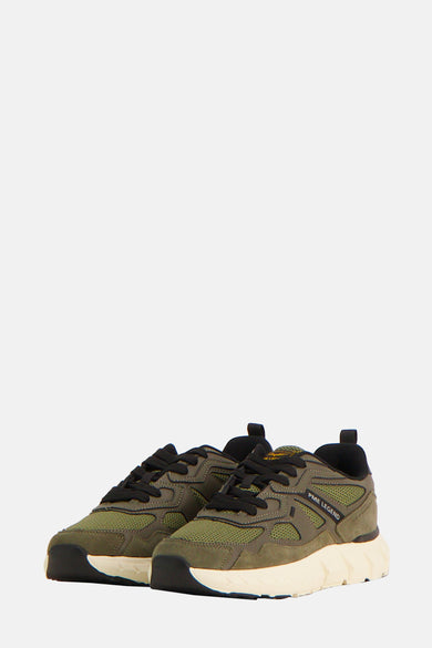 Kaki PME Legend sneakers, met zwarte veters en een gebroken witte dikke zool.