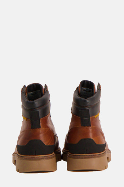 Bottines marron de PME Legend, présentant un design robuste avec détails noirs au niveau du talon et du col.