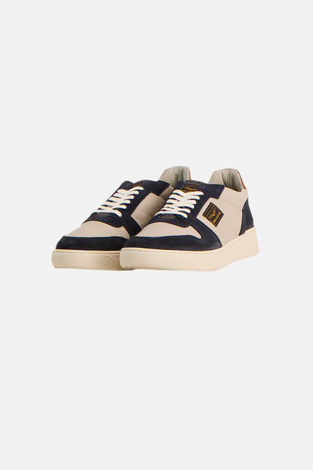 Blauwe PME Legend sneakers met bruin leren inzetstuk op de hiel, achteraanzicht.