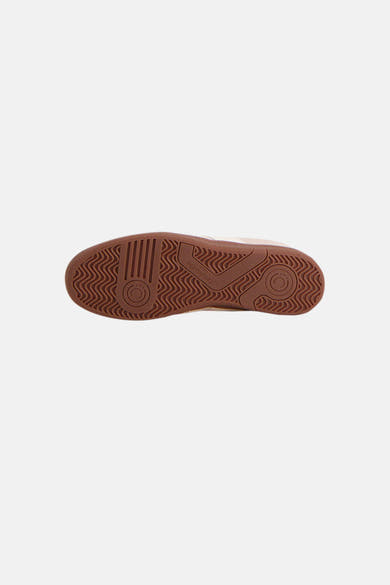 Semelle de baskets beige de Pantofola d'Oro, avec motif ondulé et détail circulaire texturé.