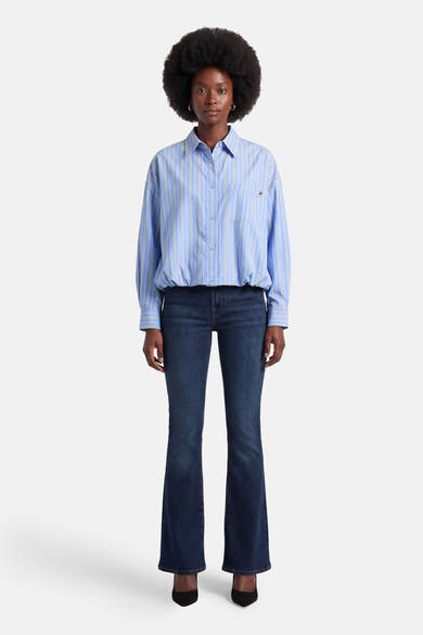 Chemise à manches longues bleue à rayures by ADORE, avec des poches et des boutons.
