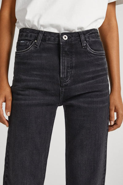 Dark blue flared jeans with slim fit and classic five-pocket design, worn with white top, front view