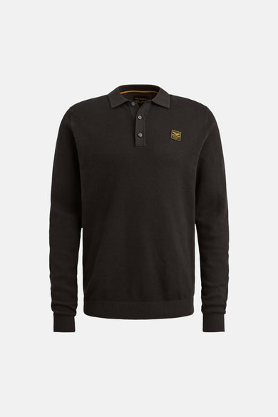 Black textured long-sleeve polo shirt with ribbed cuffs and collar, featuring a small gold patch on the chest, front view.
