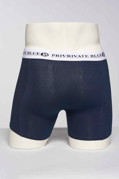 Blauwe boxer van PRIVATE BLUE, effen model getoond op een paspop, achterzicht.